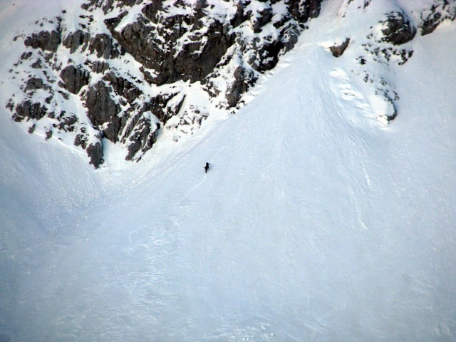 Alpinista na vstopu v Wisiakovo grapo v Planjavi.